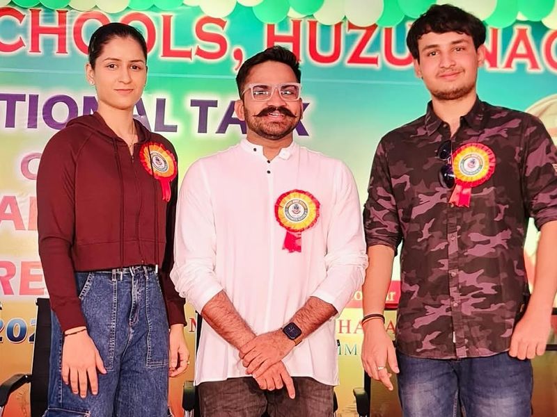 Dr. Naina Jaiswal on stage with Sandeep Bhaga at the Greenwood Schools event in Huzurnagar