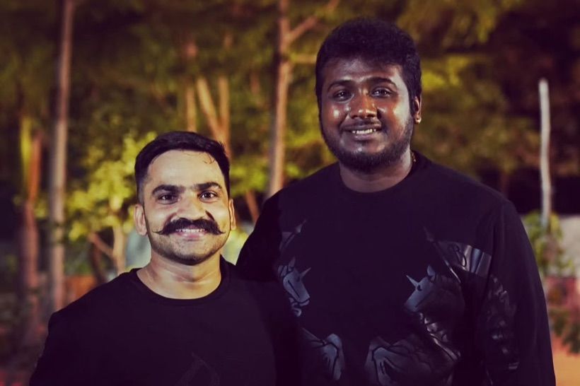 Sandeep Bhaga and singer Rahul Sipligunj smiling side by side outdoors in the evening